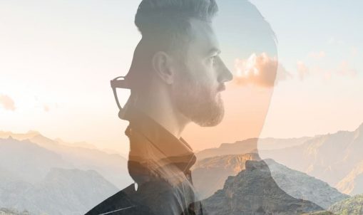 OCD concept: Double exposure of man's profile and mountain range, symbolizing mental health and intrusive thoughts.